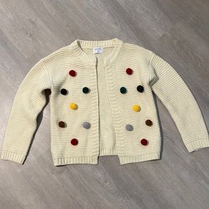 Cream Cardigan with multi-colored pom poms